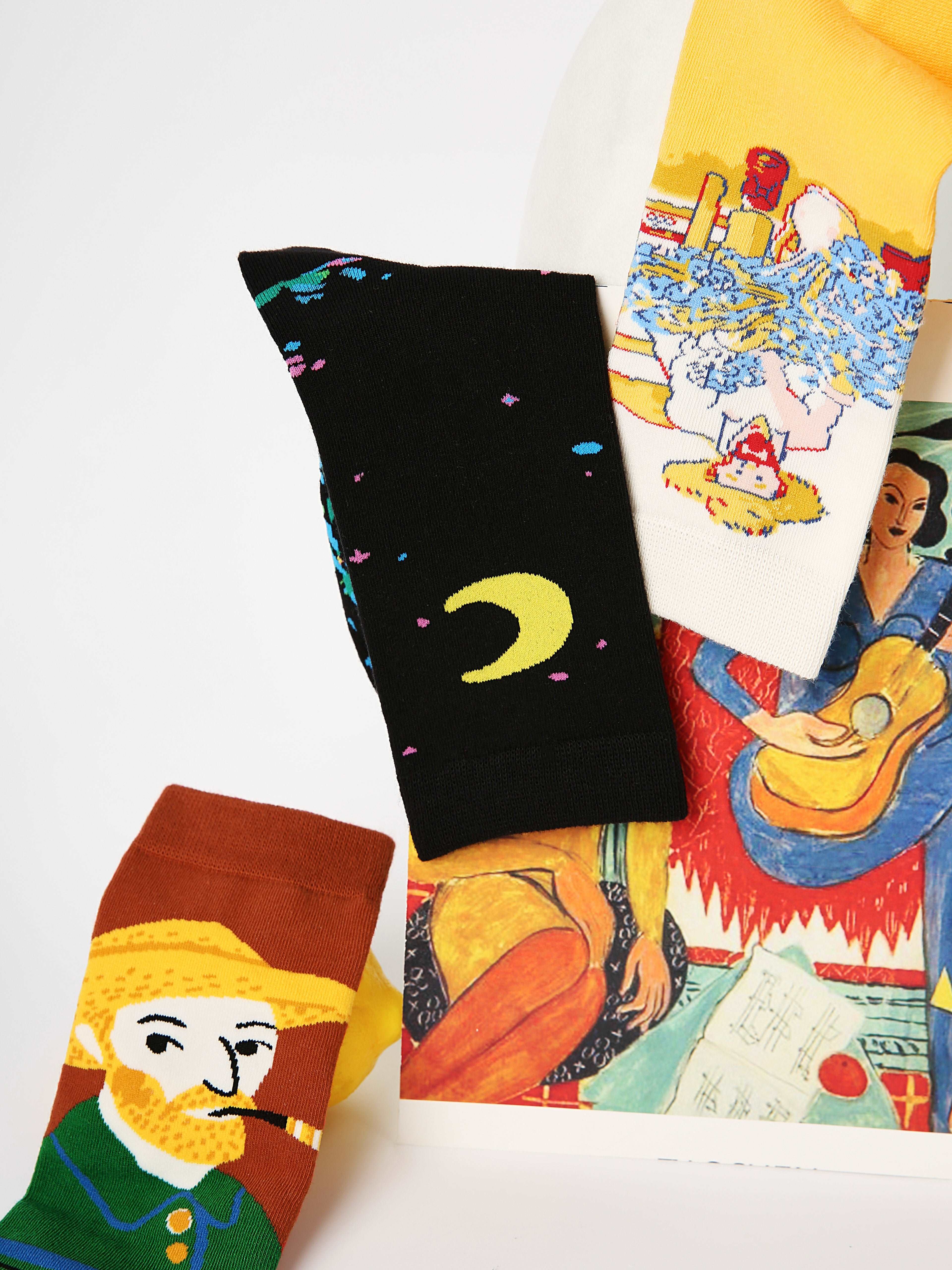 Set of three Starry Night-themed socks with unique patterns