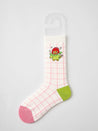 Detail of a single sock adorned with a playful cartoon character, part of a trendy sock collection for women