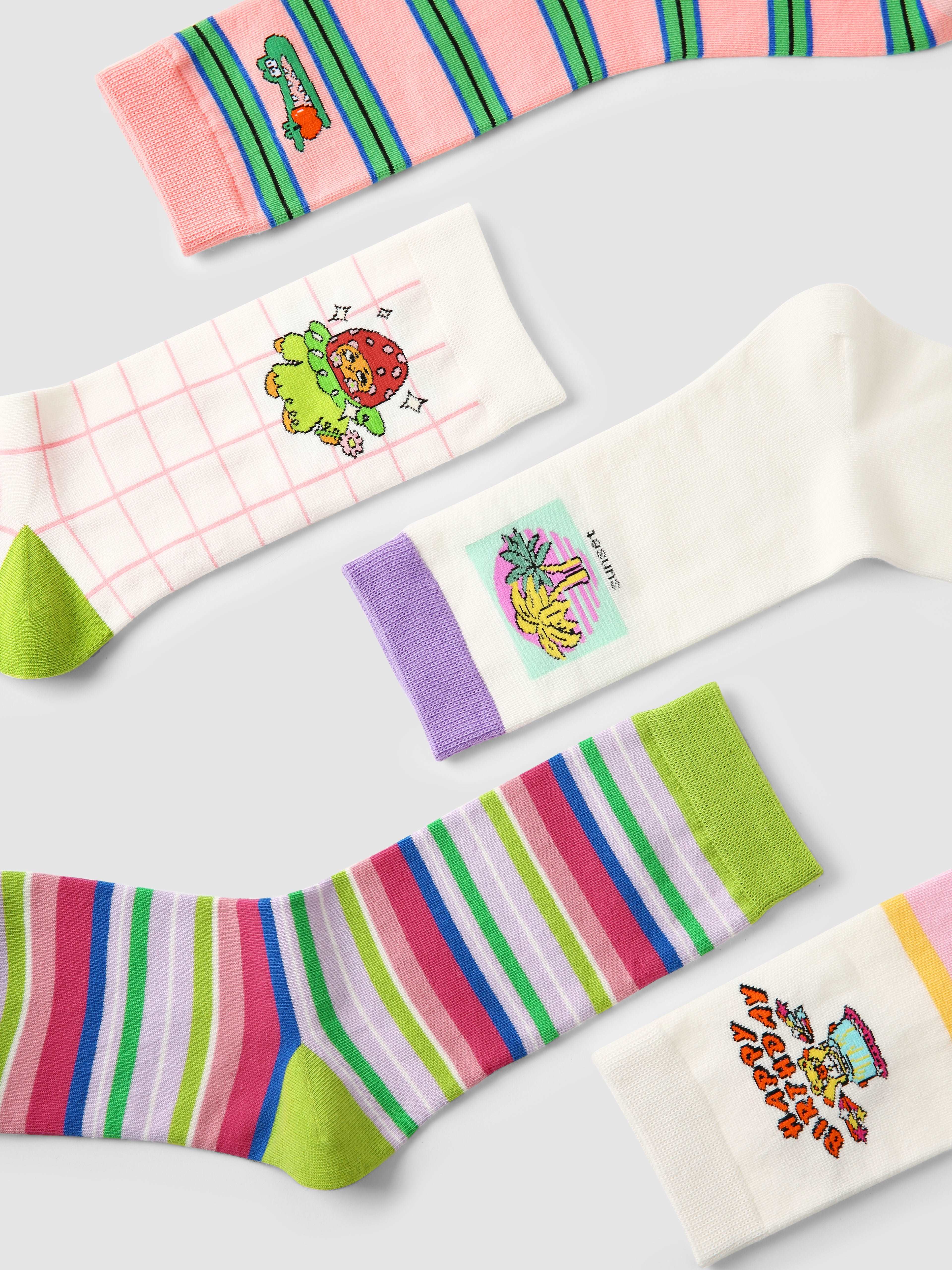 Multiple pairs of women's fashion socks featuring cute cartoon designs