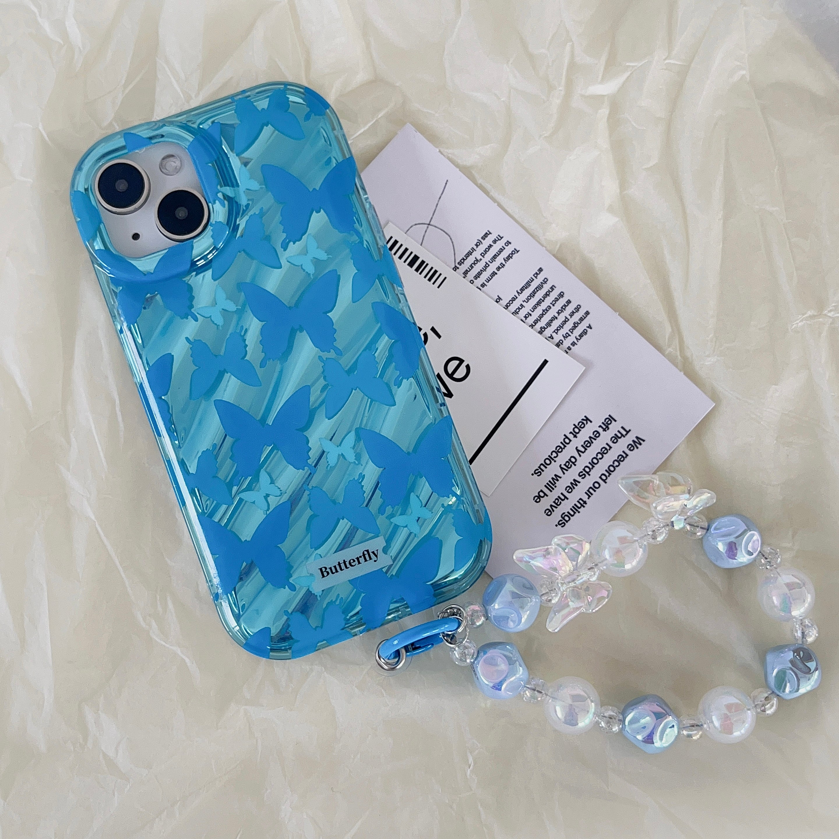 Ice blue camouflage-patterned iPhone case paired with a bracelet and an iPhone mockup