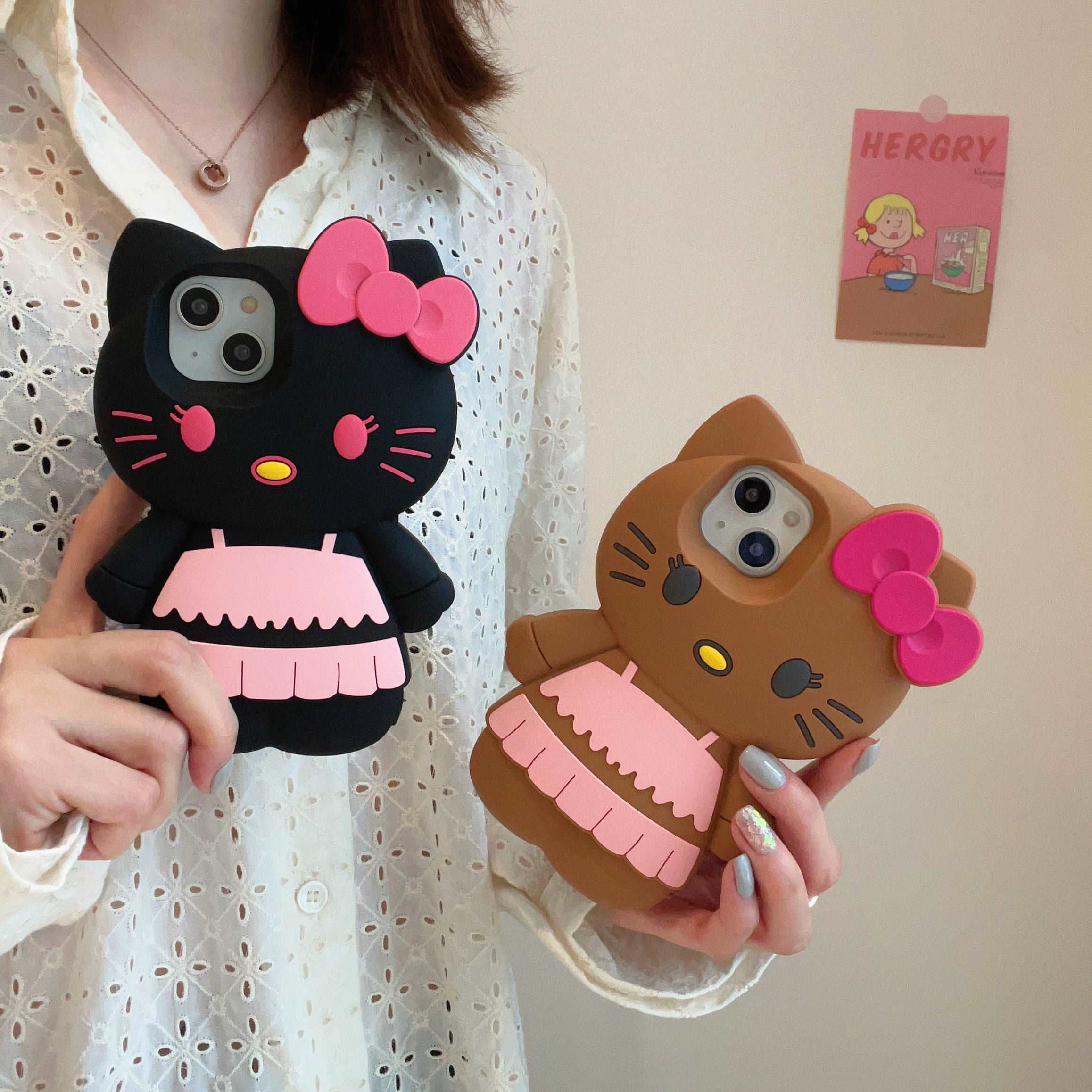 Frontal views of two black and brown Hello Kitty iPhone cases compatible with iPhone 13 Pro