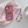 Pink butterfly iPhone case for iPhone 14 Pro featuring a coordinating bracelet accessory