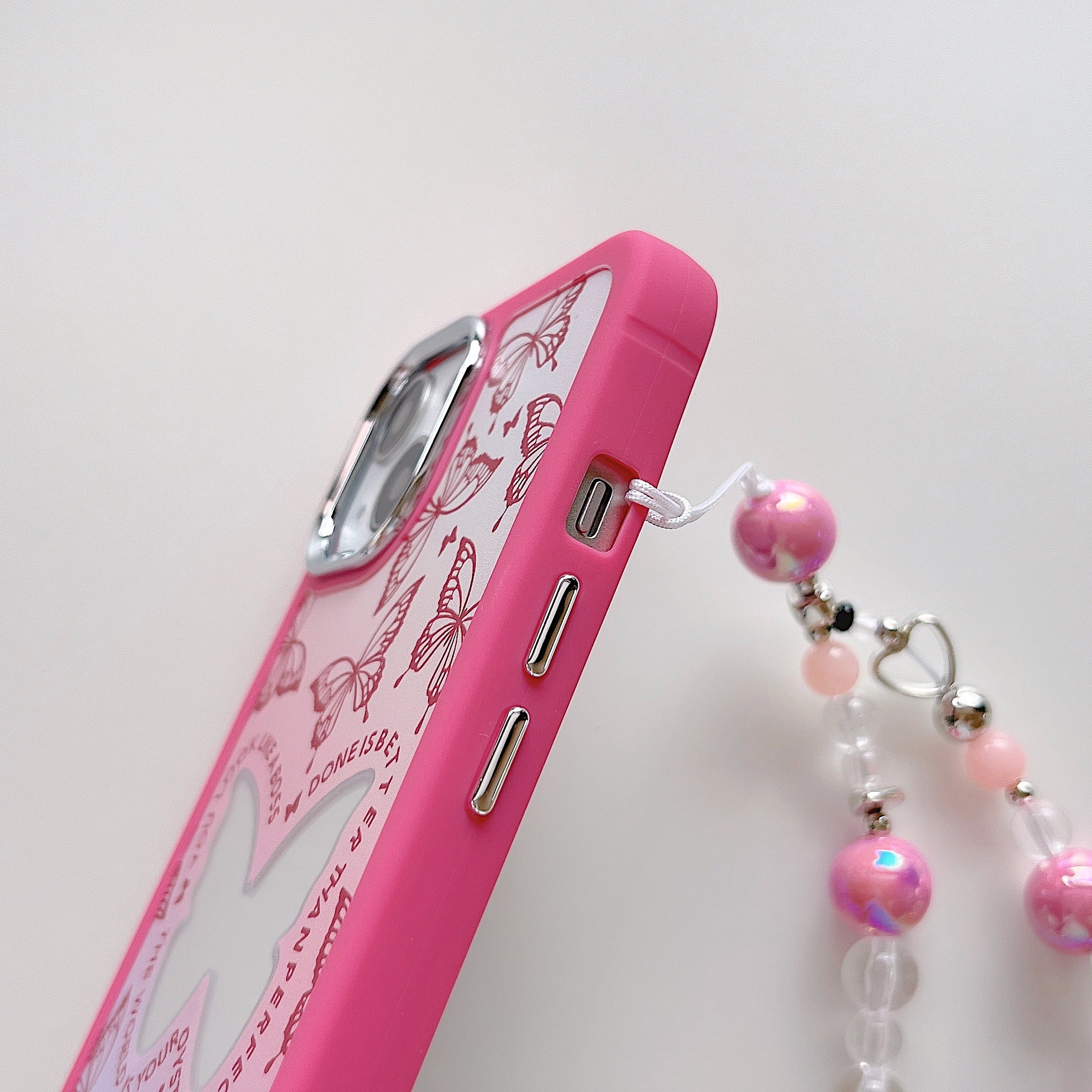 Y2K-themed pink iPhone case showcasing a butterfly design for iPhone 14 Pro Max