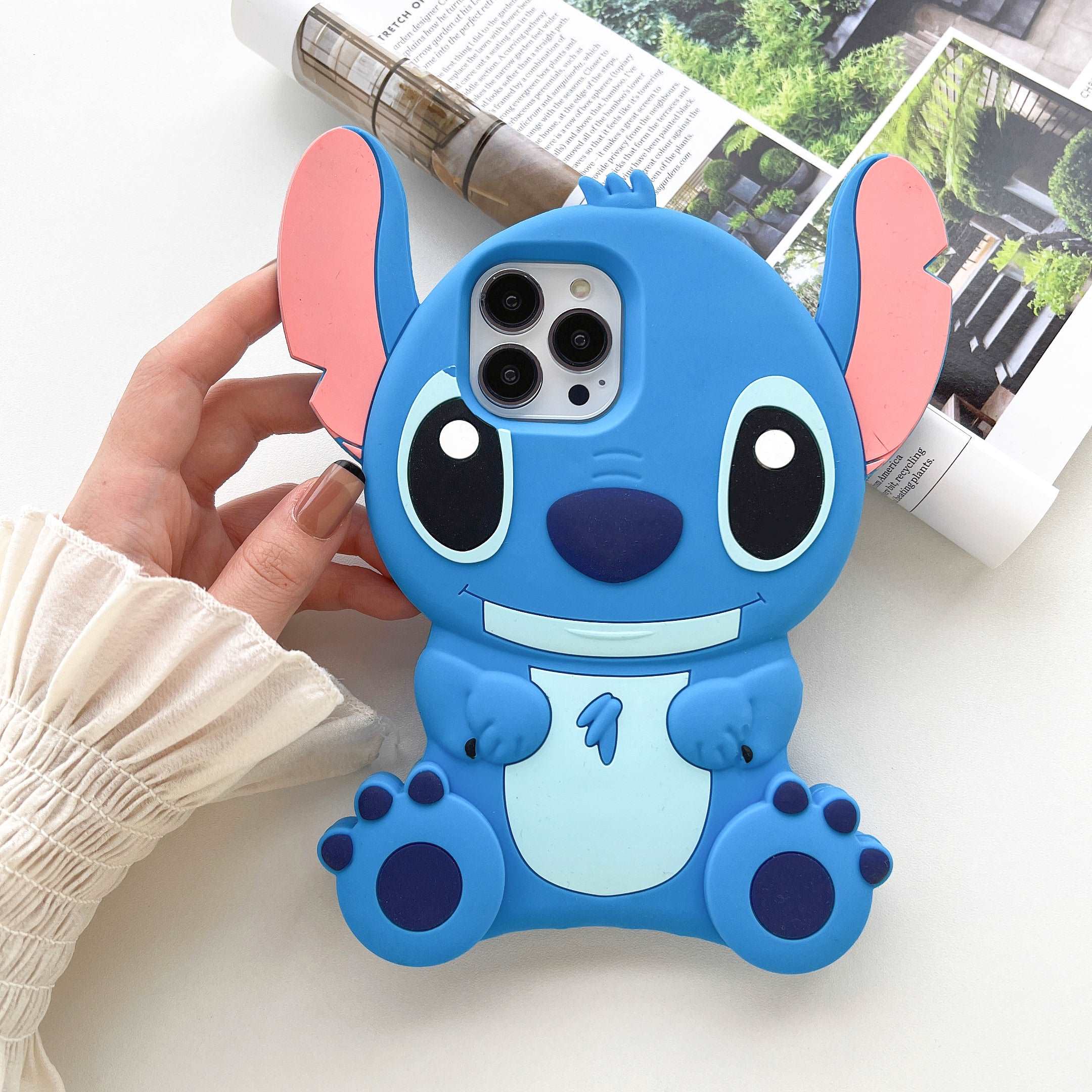 Close-up view of a blue Stitch-themed soft silicone case for iPhone 14 Pro