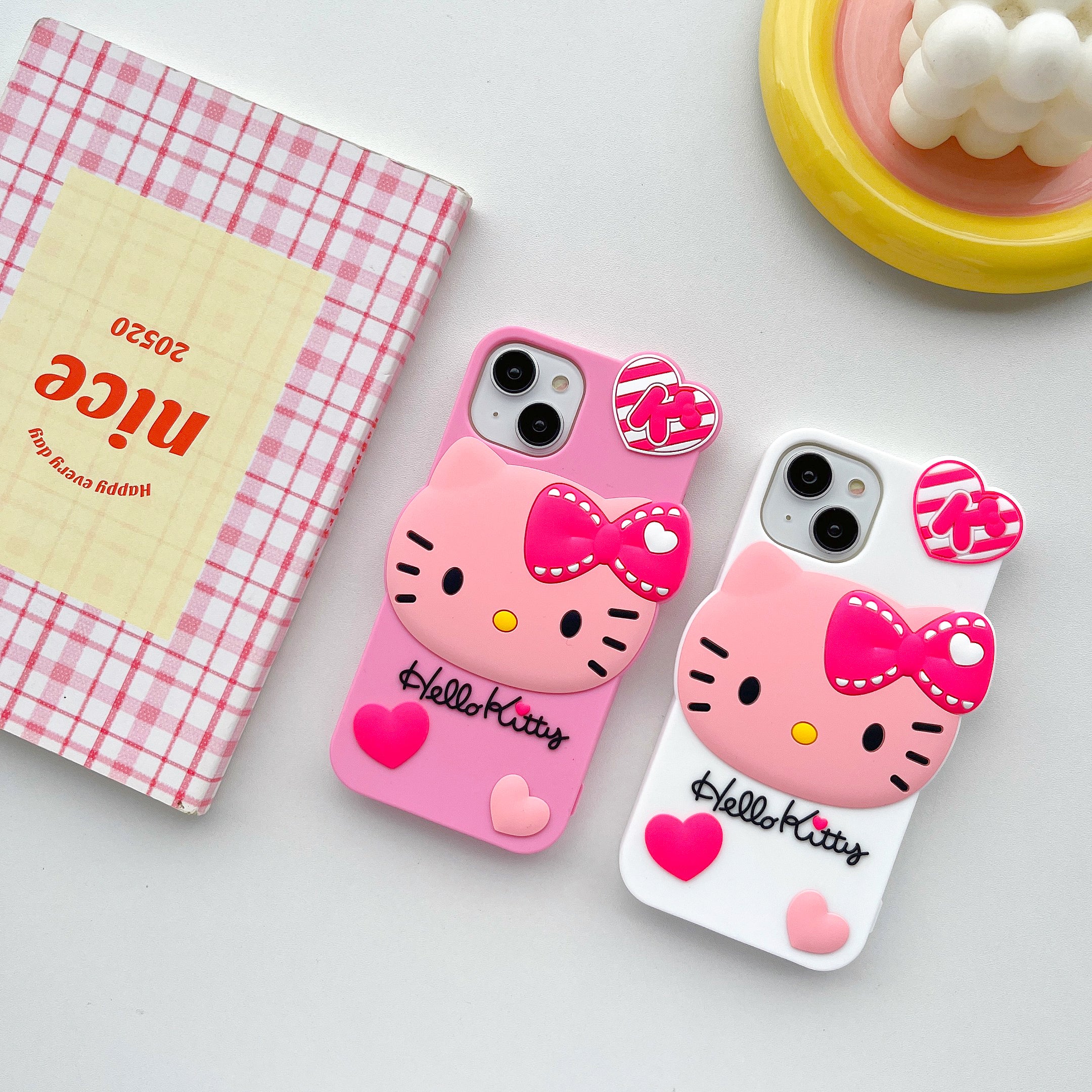 Detailed view of the Hello Kitty case with a pink and white motif for iPhone